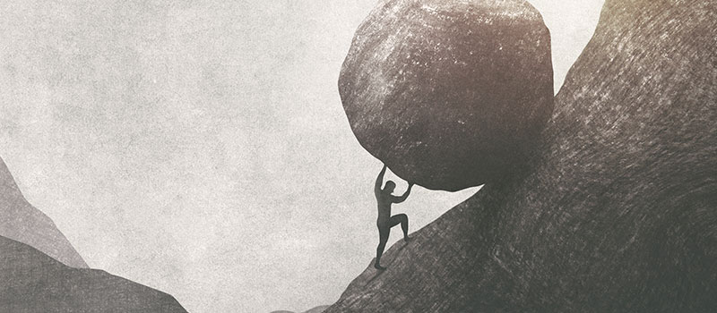 Illustration of man pushing boulder to the top of mountain